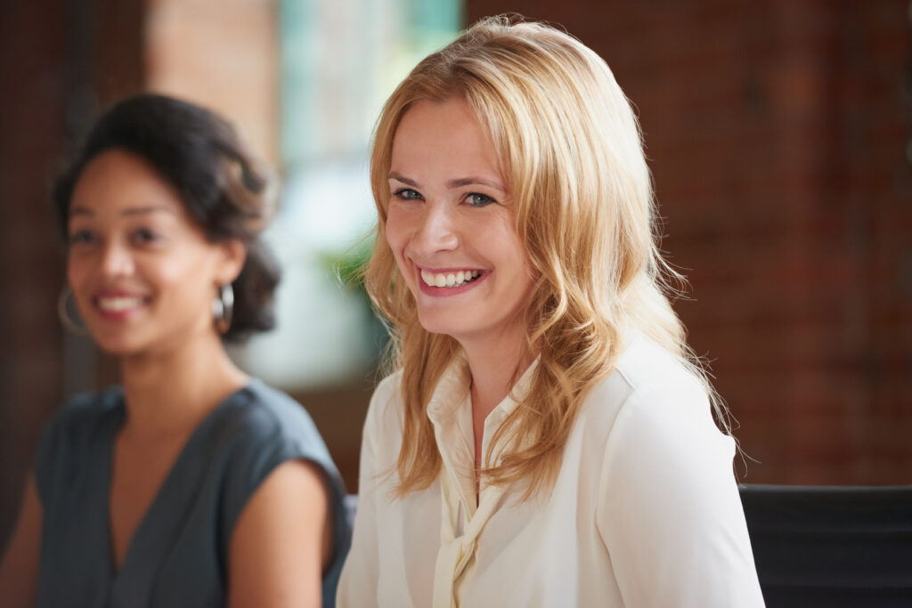 Woman smiling | start your next online therapy session.